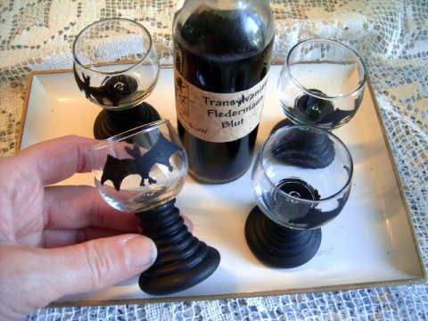 BTcl.jpg Shot glasses were green glass like mini wine glasses. Painted them black and added a bat. image by Vickibutterfly