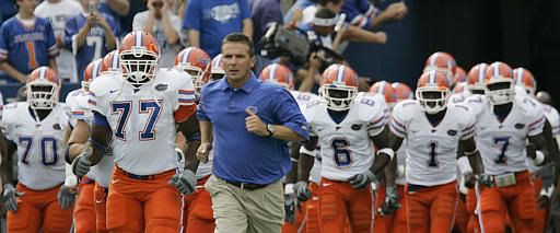 Urban Myer Leading the Gators out Pictures, Images and Photos